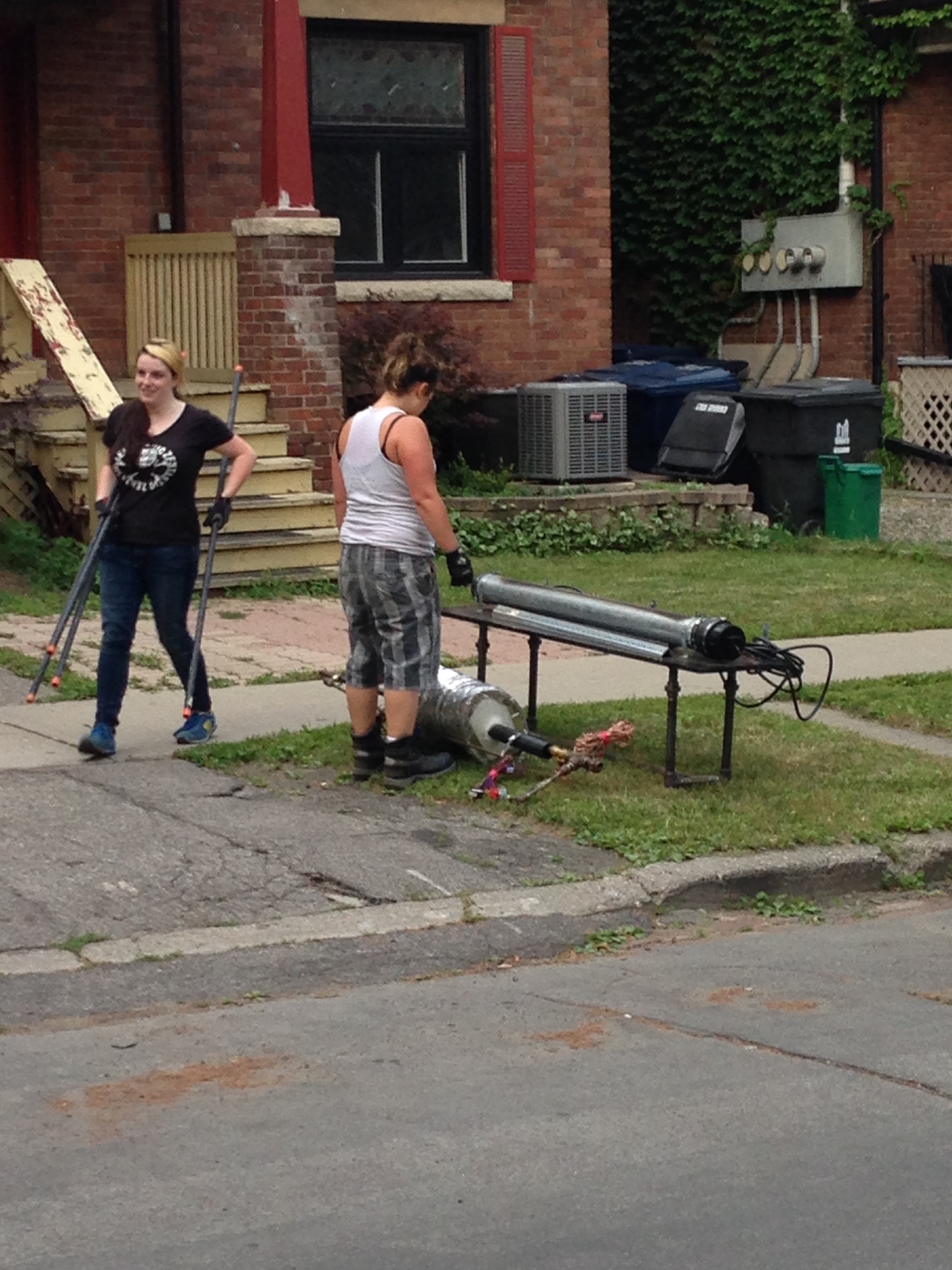 S joyfully moves pipe while Trish ponders the Reuben's tube that is part of Francis the Fantastic.